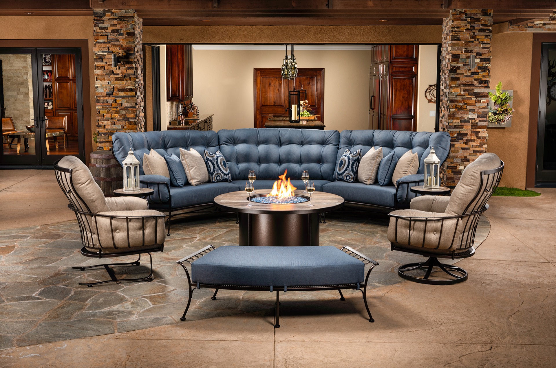 Covered patio with plush outdoor sectional and fire pit table